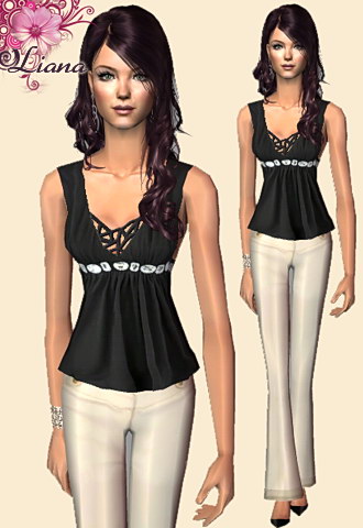 black sleeveless top with white gems and beige pants