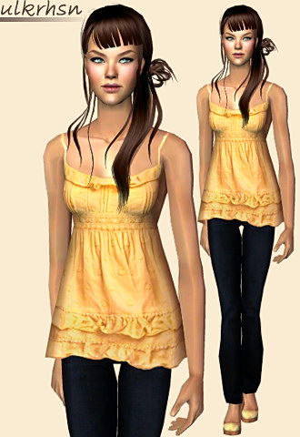 Fancy ruffled baby-doll blouse with skinny pants and sand wrapped heels.