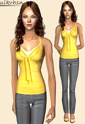 Yellow silk blouse with decorative bow and skinny jeans featuring high heeled shoes.